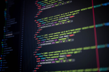 Close-up of colorful programming code on a screen showing sort direction and sort field, symbolizing web development, software engineering, coding, and digital technology background.