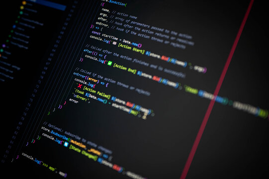 Close-up of colorful programming code on screen showing console.log with Action Start, End, and Failed for debugging and error handling, symbolizing software development and digital technology.