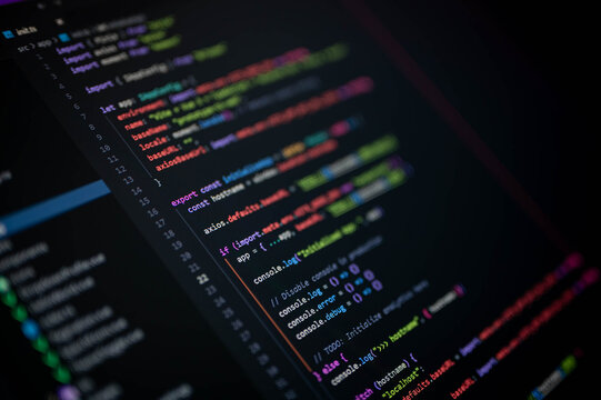 Close-up of colorful programming code on screen showing Vue configuration with axios.defaults and console debugging, symbolizing frontend development, software engineering, and digital technology.