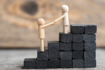 Wooden figures on black blocks, helping each other