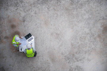 Top view of expert engineers planning to draw up building structural blueprints.