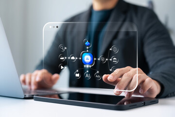 AI assistant and agent technology concept for automation, businessman using laptops and tablets with connecting artificial intelligence to cloud, data, advertising, media, digital marketing platforms.
