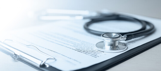 Stethoscope on medical document symbolizing health insurance, diagnosis, and patient care. Perfect for concepts of healthcare policy, hospital record, treatment, medical service, and protection.