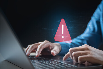 Cybersecurity alert warning on laptop, symbolizing online threats, data breach, malware attack, internet risk, IT security, hacking, phishing, ransomware, system protection, and digital safety.