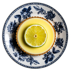 Lemon tart with a slice of lime on top, presented on a decorative ceramic plate, top-down view.
