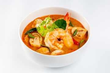Prawn Tom Yum in a white bowl on a white background