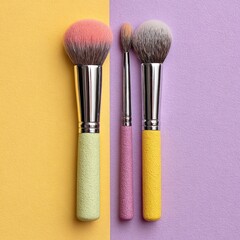Three makeup brushes, pastel handles, different sizes