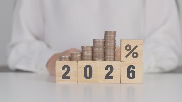 2026 New year with percentage change to UP and Down arrow with coin stack. Interest rate, GDP, stocks market, financial, deflation and Inflation, mortgage, debt, Loan and Economic Recession