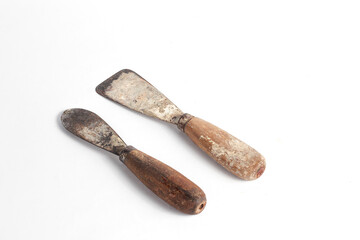 Rusty putty knife carpentry tool isolated on white background