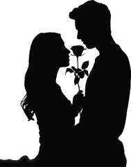 Silhouette of a couple sharing a rose at sunset