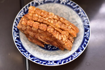 Crispy fried pork on white plate, Delicious glazed pork belly with crispy skin, Crispy Pork