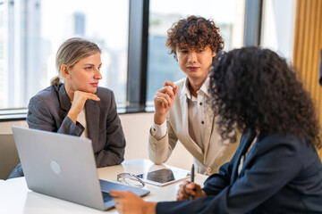 Diverse tech team meeting on software project, mentor guiding coworker on laptop, teamwork development using collaboration tools, modern technology, app design, dev training and enterprise SaaS team