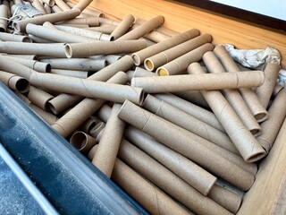 Stack of empty cardboard marijuana canabis tubes ready for recycling or reuse in eco friendly packaging