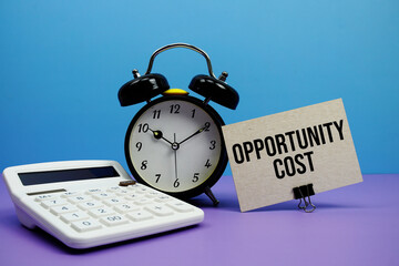 Opportunity Cost text with calculator and alarm clock on blue and purple background