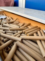 Stack of empty cardboard marijuana canabis tubes ready for recycling or reuse in eco friendly packaging