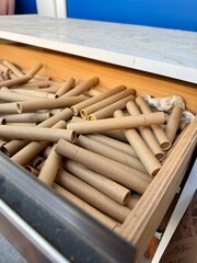 Stack of empty cardboard marijuana canabis tubes ready for recycling or reuse in eco friendly packaging