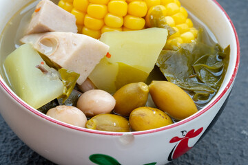  Sayur Asem, a traditional Indonesian vegetable soup with corn, melinjo, and jackfruit, served in a classic rooster-patterned bowl (mangkok ayam jago).