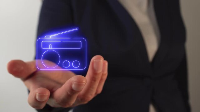 Woman's hand holding a virtual radio icon
