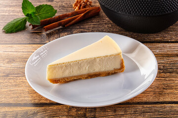 Classic delicous cheesecake slice served mint