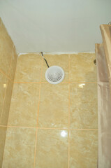 Bathroom ceiling and wall with an extractor fan