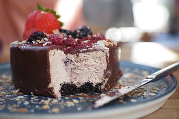 Delicious chocolate cake with berries on a plate