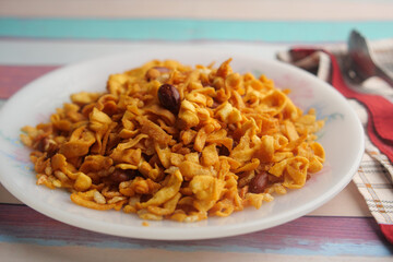 Crispy fried snack served on a white plate at home