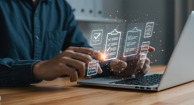 Man interacting with digital battery level indicators on a laptop