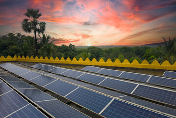 Beautiful view of solar panels with dramatic sky and forest background.