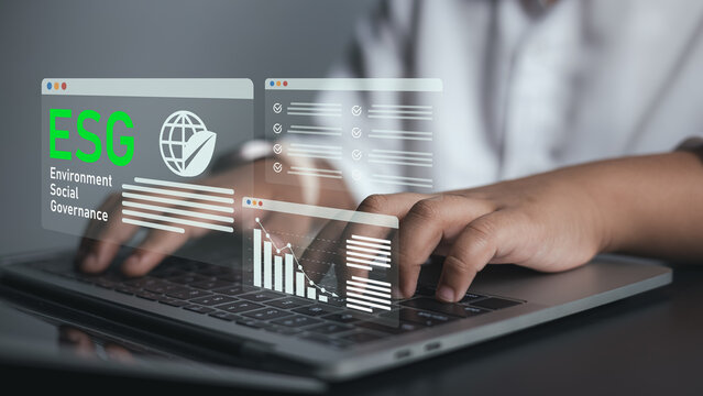 Business Person Analyzing ESG Dashboard on Laptop Representing Sustainability and Ethical Investing