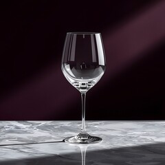 Premium wine glass mockup on marble table with dramatic lighting, elegant product showcase