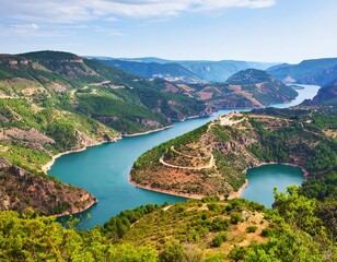 Panoramic view of a winding river valley and reservoir