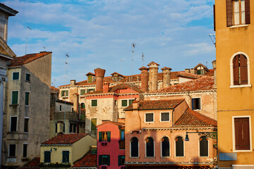 Historic residential buildings with colorful facades in Venice, Italy. Traditional European architecture and travel destination.