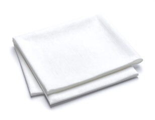 Two folded white cloths against white background