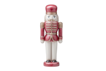A red and gold nutcracker soldier isolated on transparent background