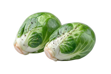 Fototapeta premium Two fresh brussels sprouts seasoned with pepper isolated on transparent background