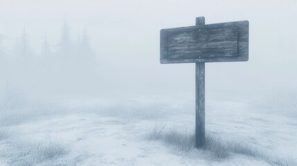 Blank wooden sign in snowy foggy landscape