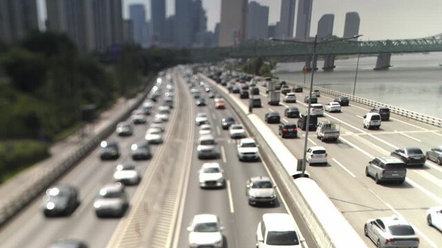 Timelapse shot near Yeouido, Seoul, using a Canon tilt-shift lens on a Sony FX30 body. The miniature effect emphasizes the cityscape, creating a miniature perspective.