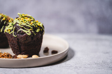 A delicious muffin with aromatic Arabic chocolate, served on an elegant plate. A delicate cake with a fluffy texture. Stylish dessert photography.