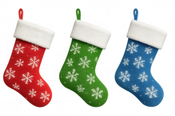 Festive wool christmas stockings in red, green, blue featuring white snowflake patterns hanging against transparent background
