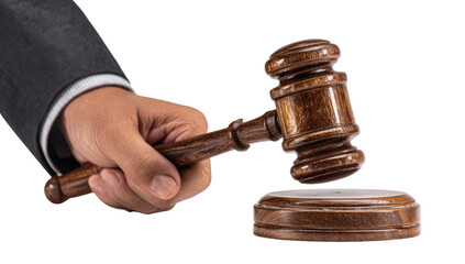 Judge's hand holds wooden gavel, ready to strike
