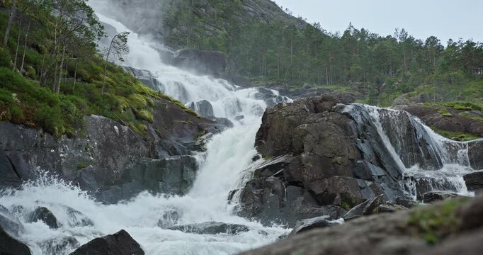 Langfossen Waterfall Cascading Over Rocks, Akrafjorden, Norway
