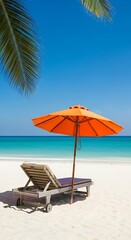 Fototapeta premium Orange umbrella and lounge chair on sandy beach ocean