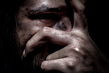 Close-Up of Distressed Face with Hand Covering Eye – Horror Theme