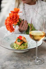 Savor a gourmet dish with flowers and fine wine in