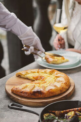 Gourmet Pizza Artfully Presented, Served Elegantly, Set in a Modern