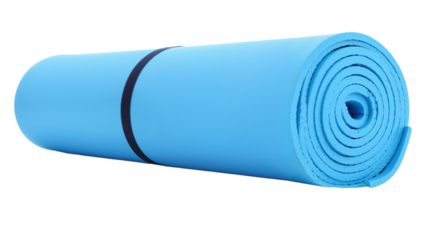 Rolled blue yoga mat ready for practice in a serene indoor space during early morning hours