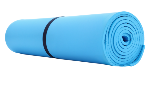 Rolled blue yoga mat ready for practice in a serene indoor space during early morning hours