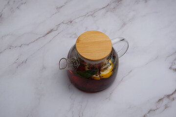 This is a Stylish Glass Teapot equipped with a Bamboo