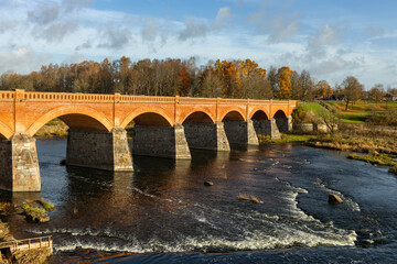 Vintage arch bridge over the river.