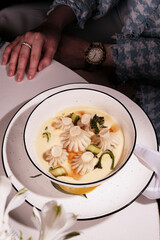 This is a Delicious and Creamy Soup served with Artistic